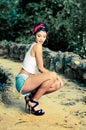 Pin-up girl. American style, in a garden Royalty Free Stock Photo