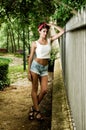 Pin-up girl. American style, in a garden Royalty Free Stock Photo