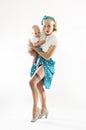 Pin-up girl with baby Royalty Free Stock Photo