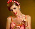 Pin up girl drink bloody Mary cocktail. Pin-up retro female style. Royalty Free Stock Photo