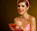 Pin up girl drink bloody Mary cocktail. Pin-up retro female style. Royalty Free Stock Photo