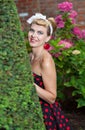 Pin-up girl outdoor in the garden