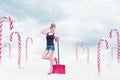 Pin-up girl with snow shovel Royalty Free Stock Photo