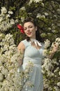 Pin up girl in the spring time with dogwood tree Royalty Free Stock Photo