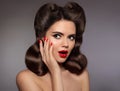 Pin up girl surprised with red lips makeup and manicured nails, Royalty Free Stock Photo