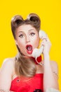 Pin-up girl talking on retro telephone Royalty Free Stock Photo