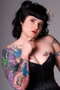 Pin-up girl with tattoos.