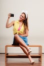 Pin up girl woman taking photo with camera. Royalty Free Stock Photo