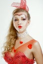 Pin-up photo of blond woman with hearts over white