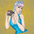 Pin-up woman with camera taking pictures Royalty Free Stock Photo