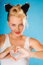 Pin up style, retro girl with heart sign. Royalty Free Stock Photo