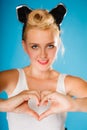 Pin up style, retro girl with heart sign. Royalty Free Stock Photo