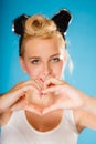 Pin up style, retro girl with heart sign. Royalty Free Stock Photo