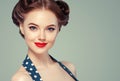 Pin up woman portrait. Beautiful retro female in polka dot dress with red lips and old fshion hairstyle Royalty Free Stock Photo