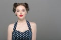 Pin up woman portrait. Beautiful retro female in polka dot dress with red lips