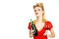 Pin up woman in red dress holding glass of red wine isolated over white background, Royalty Free Stock Photo