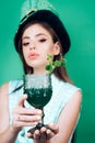 Pin up woman with trendy makeup. pinup girl with fashion hair. retro woman drink summer cocktail. St. Patricks Day Royalty Free Stock Photo