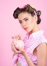 Pin up woman with trendy makeup. pinup girl with fashion hair. retro woman with moneybox. loan. Money. Housewife. pretty Royalty Free Stock Photo