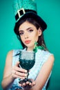 Pin up woman with trendy makeup. St. Patricks Day pinup girl with fashion hair. retro woman drink summer cocktail Royalty Free Stock Photo