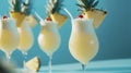 Pina colada cocktails garnished with pineapple slice and cherry