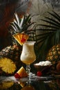 Pina colada cocktails garnished with pineapple slices and cherries