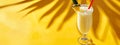 Pina colada drink on yellow banner background