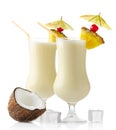 Pina colada drinks with pineaplle and ice cubes isolated on white Royalty Free Stock Photo
