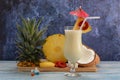 Pina colada, tropical cocktail. Glass of pina colada on a blue wooden table Royalty Free Stock Photo