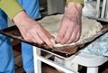 Pinching the edges of the homemade cake with your hands Royalty Free Stock Photo