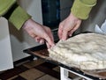 Pinching the edges of the homemade cake with your hands Royalty Free Stock Photo