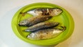 Pindang fish after frying is served on a green plate