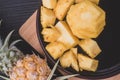 Pine apple pulear on black place and wood background