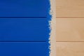 Pine boards painted in blue color and sticky tape