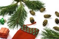 Pine branch pine cone and santa claus stocking on a white background Royalty Free Stock Photo