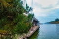 Pine branches on the background of a decorative wooden ship Royalty Free Stock Photo