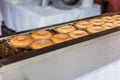 Cider Donuts Frying In Rows