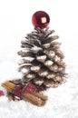 Pine cone Christmas tree and cinnamon sticks. Royalty Free Stock Photo