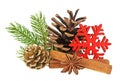 Pine cone, fir tree branch, cinnamon sticks and anise stars on white background. Christmas decorations Royalty Free Stock Photo