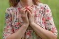 Pine cone is holding press by woman hands Royalty Free Stock Photo