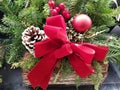 Pine cone, ornament, winterberry with red ribbons for Christmas decoration Royalty Free Stock Photo