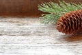 Pine cones and branches on wooden background Christmas background Copy space selective focus. Royalty Free Stock Photo