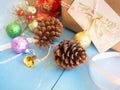 Pine cones with christmas decoration items. Royalty Free Stock Photo
