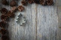 Pine Cones and Christmas Tree on a Rustic Wood Royalty Free Stock Photo