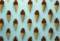 Pine cones in the ice cream cones flay lay pattern.