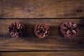 Pine cones on wooden plank Royalty Free Stock Photo