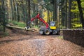 Pine forest harvesting machine and Crane forwarder at during clearing of a plantation.