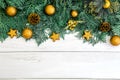 The Pine leaf with yellow gold star and christmas ball decoration on white wooden board with copy space , happy new year and chist Royalty Free Stock Photo