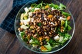 Pine Nut Salad with Walnut, Pear, Dried Apricot, Arugula or Rucola Leaves in Glass Bowl Royalty Free Stock Photo