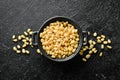 Pine nuts in a black stone bowl. Royalty Free Stock Photo