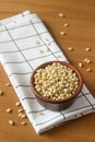 Pine nuts in a clay bowl on a wooden table